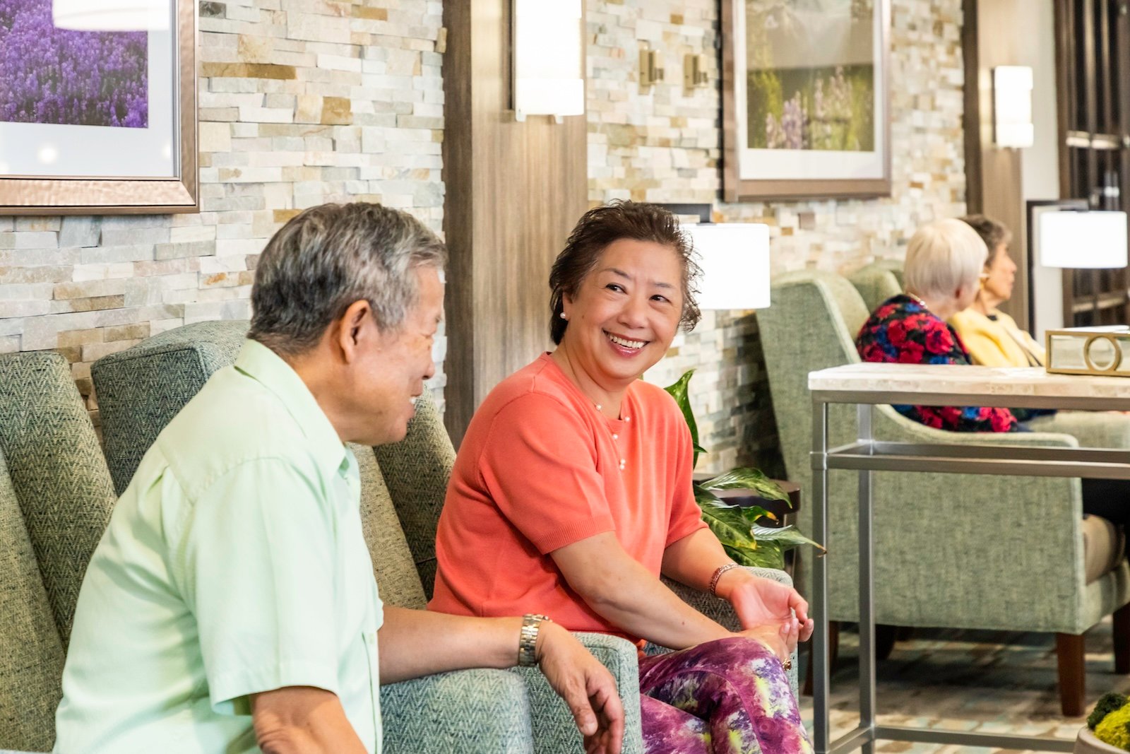 two HumanGood residents sitting and talking